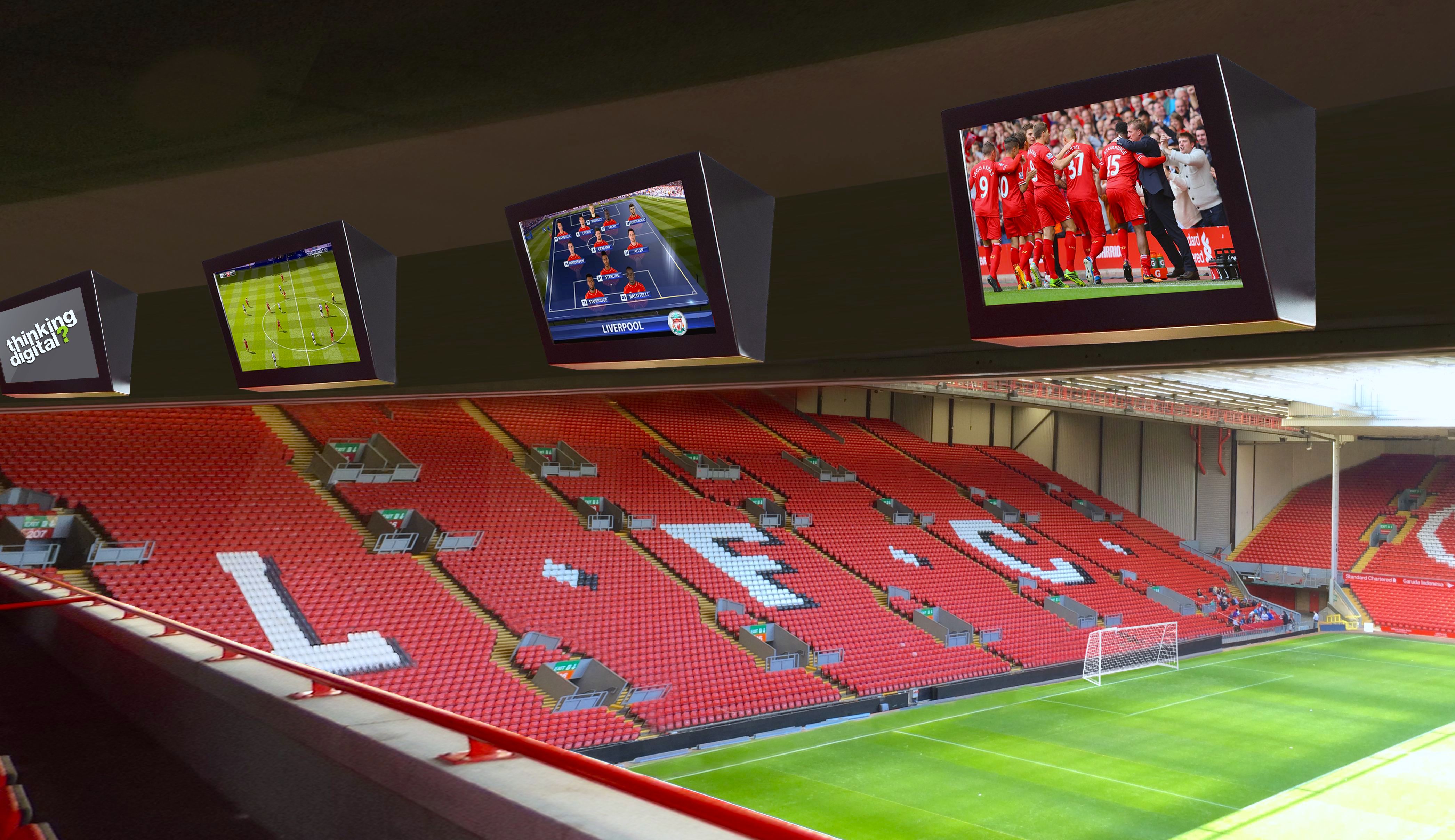 A cozy sports lounge with red walls features leather sofas, a TV displaying