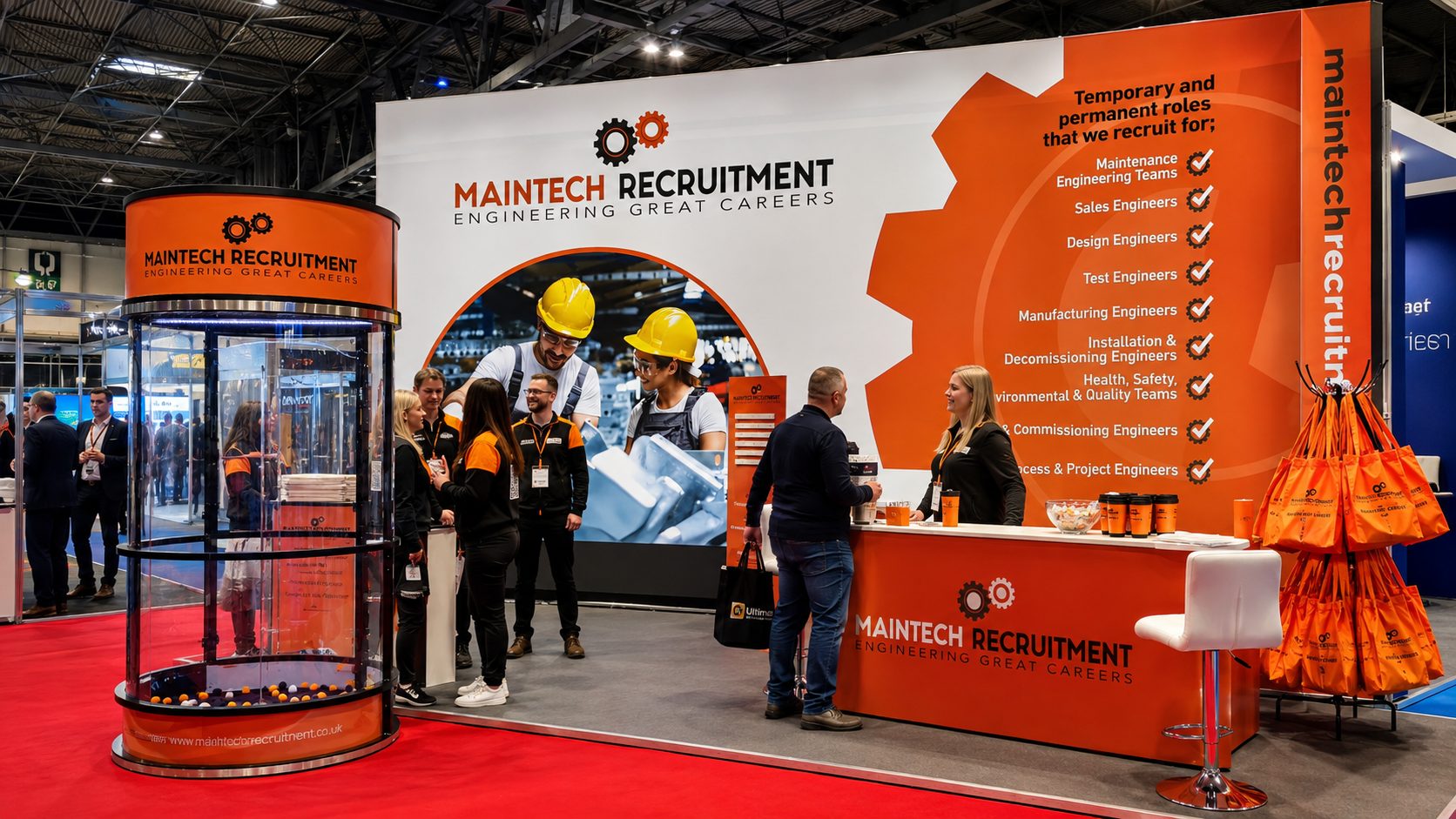 Exhibition stand for Maintech Recruitment featuring a table with chairs,
