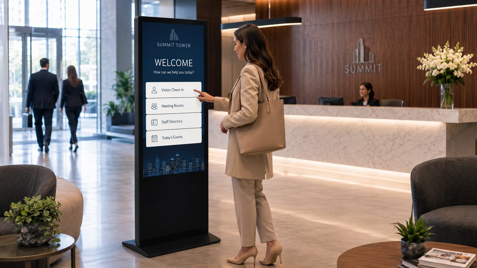 Businesswoman in a beige suit uses a tall digital directory screen in a modern hotel lobby.