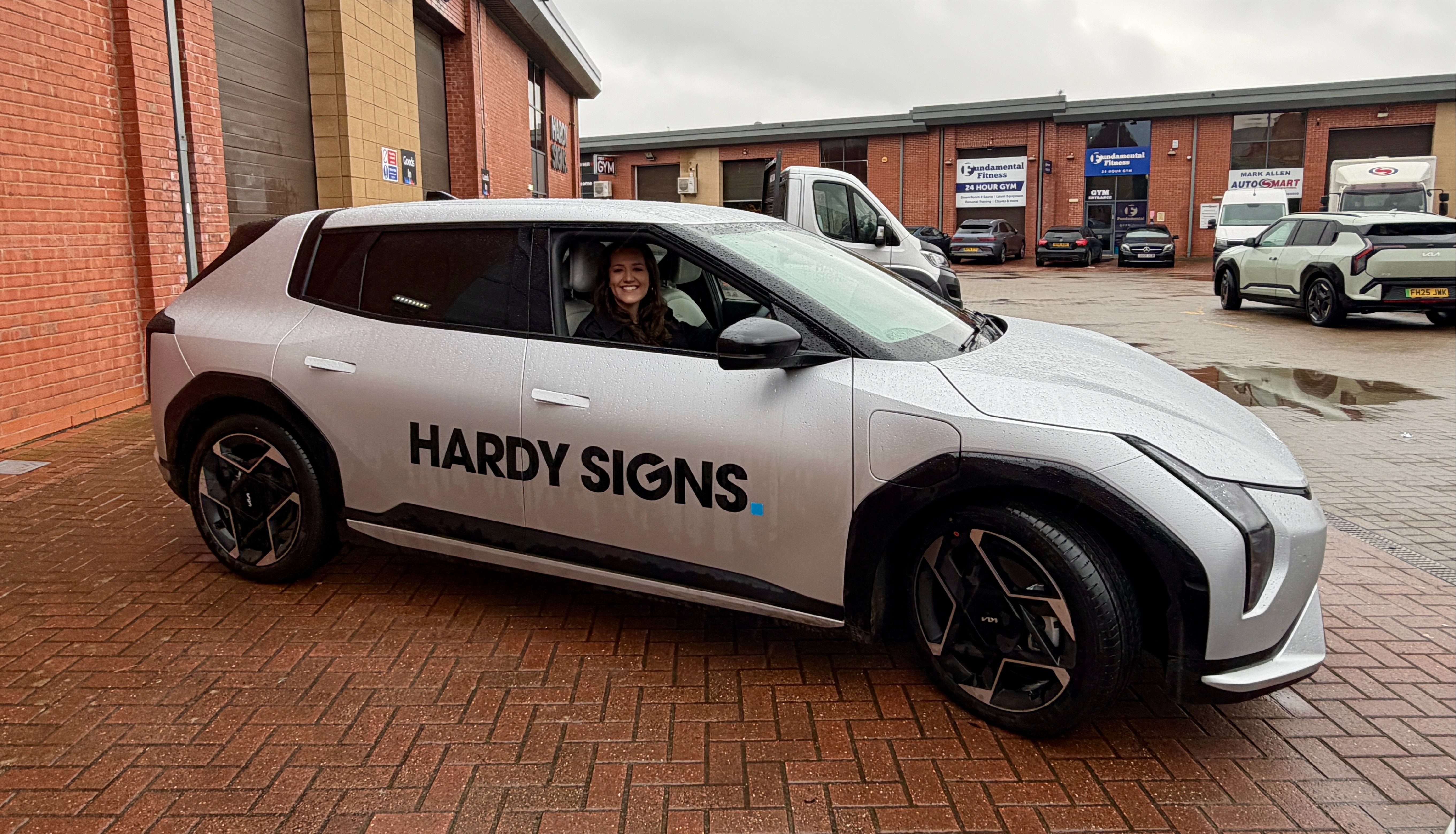 Blu Hardy inside the new EV car from Burton KIA