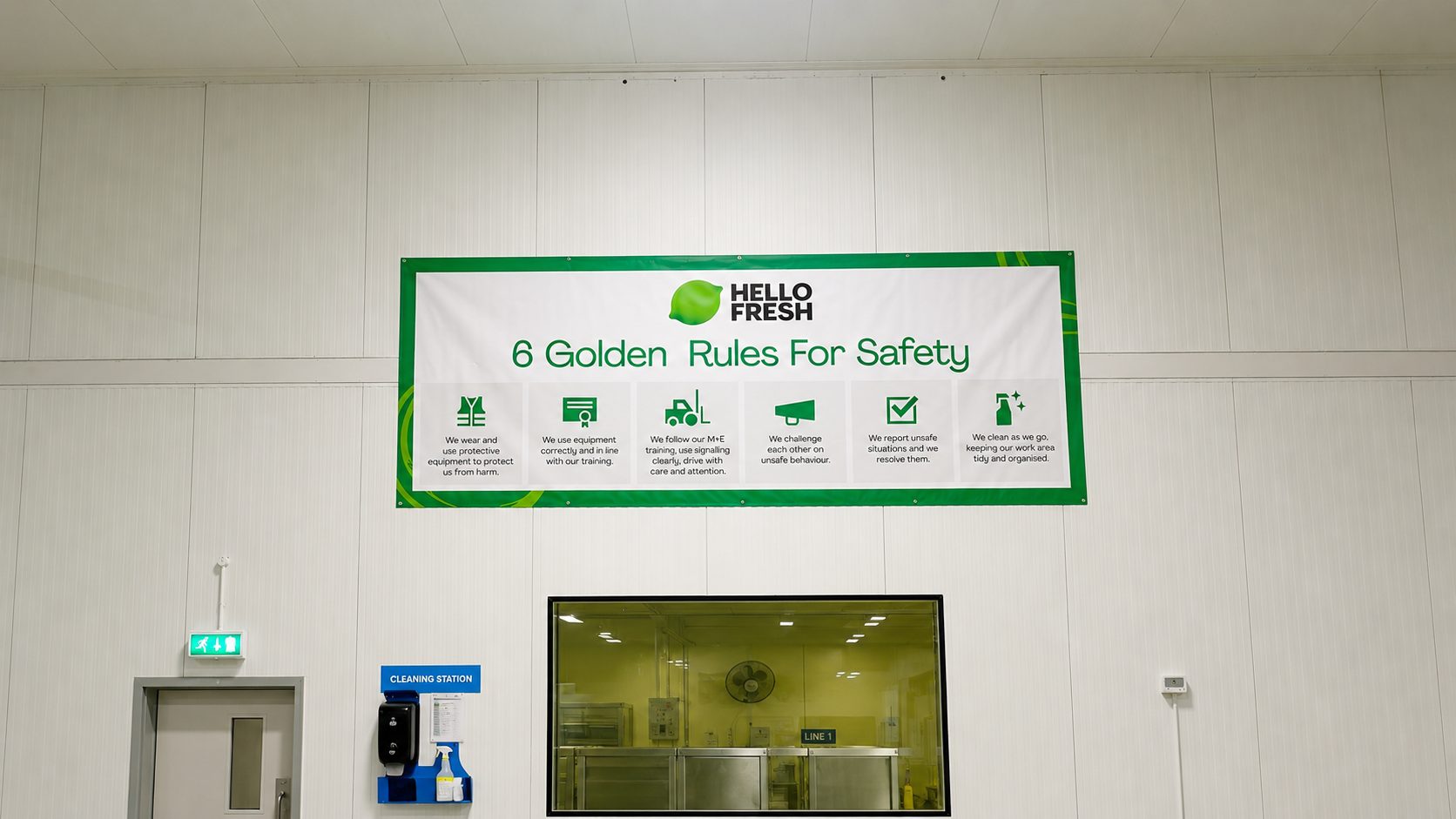 Banner reading 'Hello Fresh: 6 Golden Rules For Safety' with six green icons outlining safety rules in a clean industrial room.